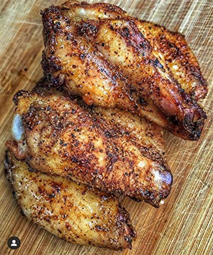 SuckleBusters Honey BBQ Rub on pork ribs highlighting balanced heat and savory-sweet notes.