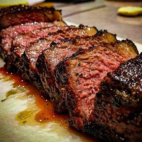 SuckleBusters SPG grilled meat—savory barbecue enhancement.