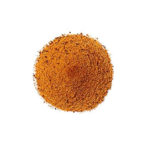 Applying the rub yields a thick, even crust before grilling.