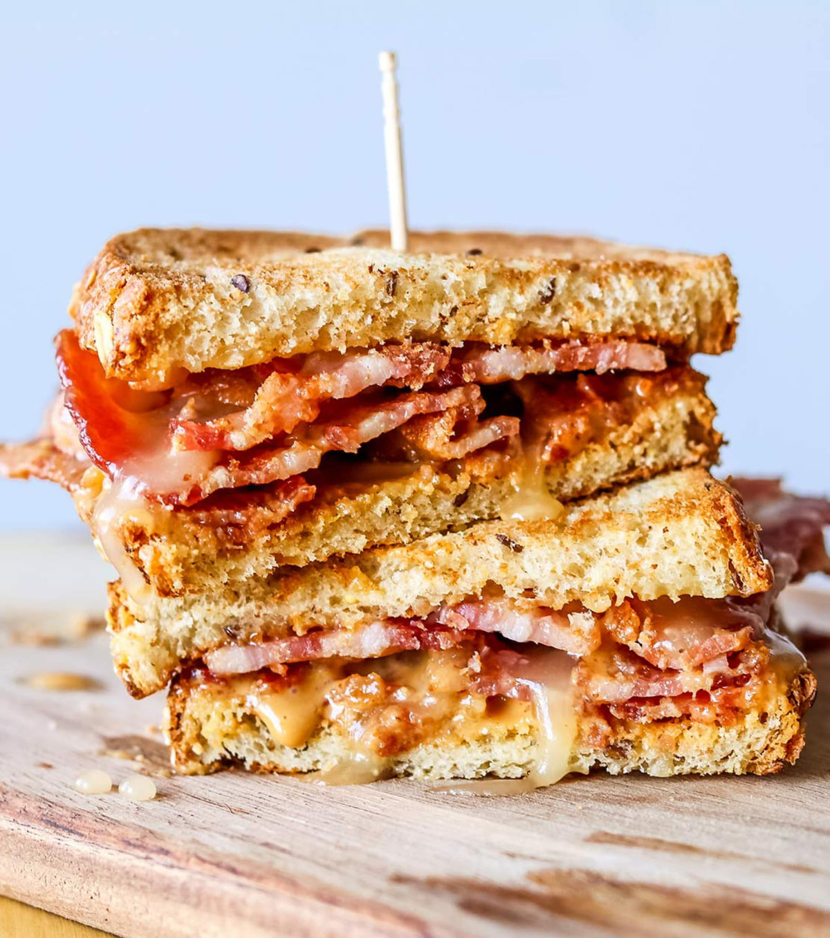 Drizzle of Sue Bee Spun Clover Honey on toast highlights versatile breakfast topping.