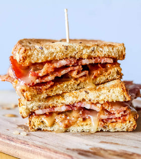 Drizzle of Sue Bee Spun Clover Honey on toast highlights versatile breakfast topping.