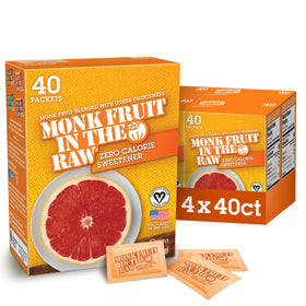 Sugar In The Raw Monk Fruit packets on desk for zero-calorie coffee sweetness.