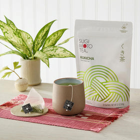 Hot brew of Sugimoto Kukicha in a cup with steam