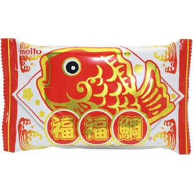 Close-up of chocolate-filled Pukupuku-tai reveals creamy center and crisp, fish-shaped shell.