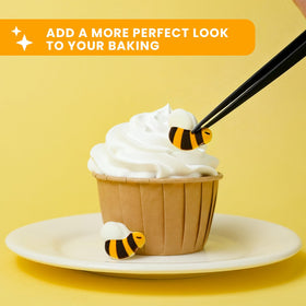 Close-up of Sujoygar edible bee toppers in vibrant colors.