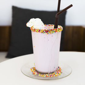 Sujoygar Rainbow Sprinkles jar label showing bulk packaging