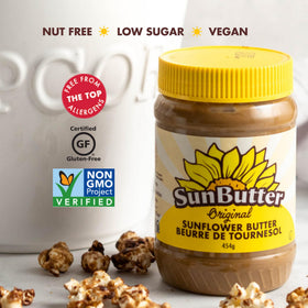 Creamy SunButter Original with a spoon highlights rich, dairy-free texture.