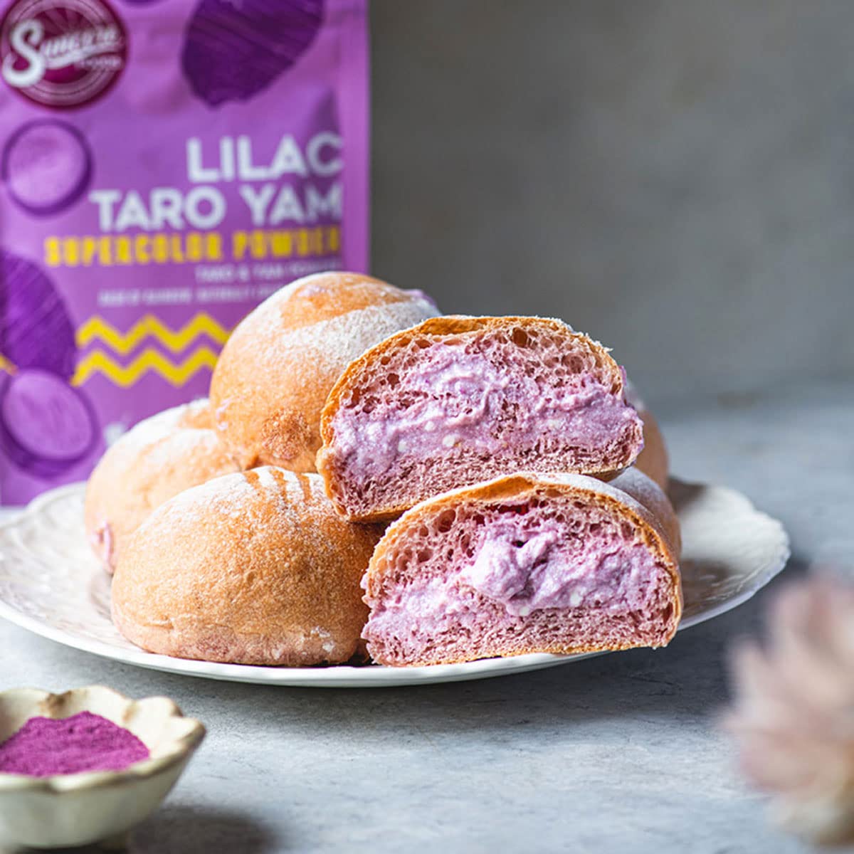 Suncore Foods Lilac Taro Yam Powder in a smoothie glass providing natural color boost.