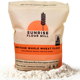 Sunrise Flour Mill Heritage Whole Wheat Flour packaging highlights organic purity for clean baking.