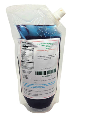 Sunshine Sno Dye Free Blue Raspberry Syrup is poured into a glass for refreshing beverages.