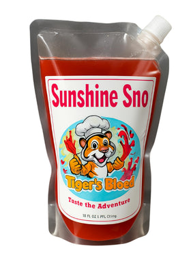 Sunshine Sno Tiger's Blood syrup bottle being poured for dye-free drinks