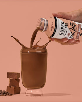 SUPER COFFEE mocha bottle in gym scene emphasizing protein-powered energy