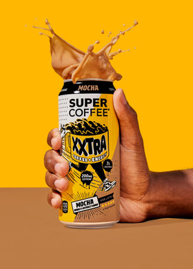 12-pack of SUPER COFFEE XXTRA on a store shelf display.