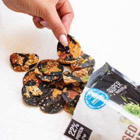 Super Natural Snack crisps with dip; perfect pairing for quick snacking.