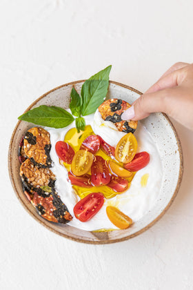 Serving idea shows Super Natural Snack crisps on a plate; great for sharing.