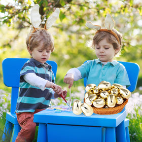 Supernal golden egg on table decor for Easter-themed event.