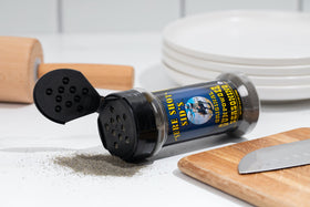 Sure Shot Sid's Gunpowder Seasoning smoked crust closeup highlights rich, savory grilling finish.