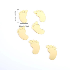 Gold SUVO baby feet toppers add a charming touch to birthday treats