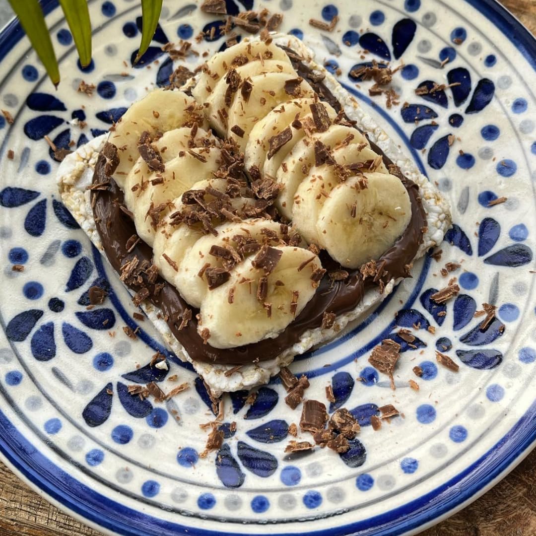 Suzie’s Brown Rice Cake Thins topped with cheese, ready to snack.