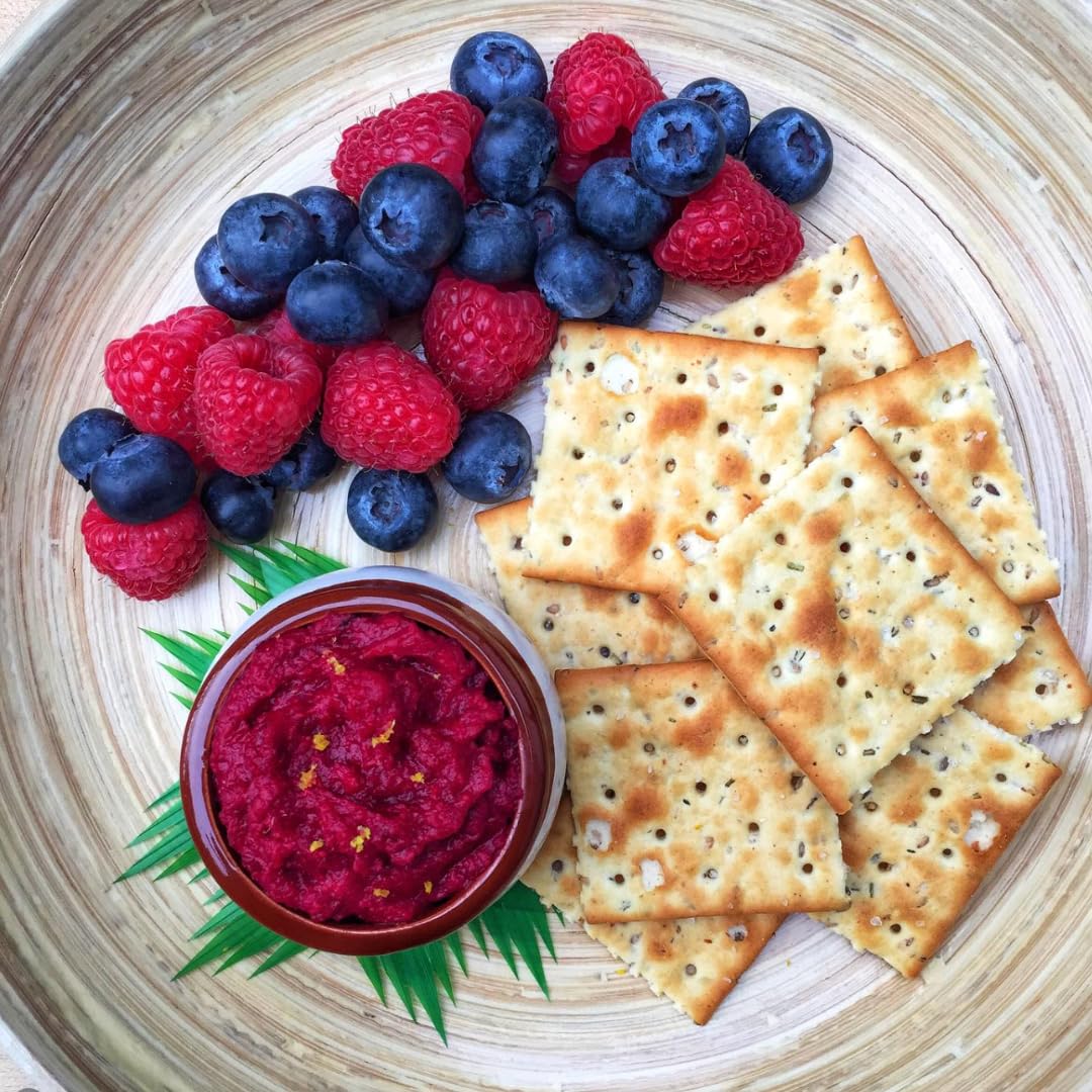 Suzie’s Organic Saltines rosemary infusion with visible rosemary specks on cracker surface.