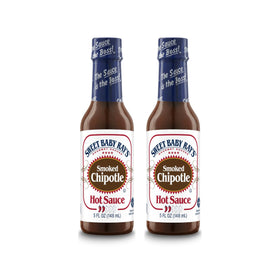 Sweet Baby Ray’s Smoked Chipotle Hot Sauce bottle pour adds rich smoky heat to meals.