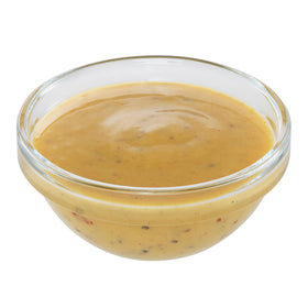 Pour shot of Sweet Baby Ray's Lemon Pepper sauce, ideal for marinades and quick meals.