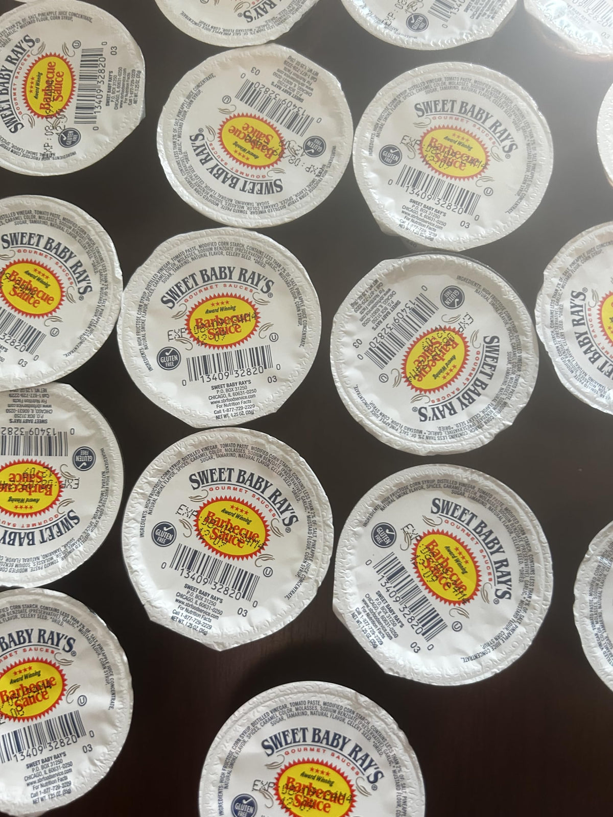 Sweet Baby Ray's Original BBQ sauce cups closeup, convenient dipping portions for meals.