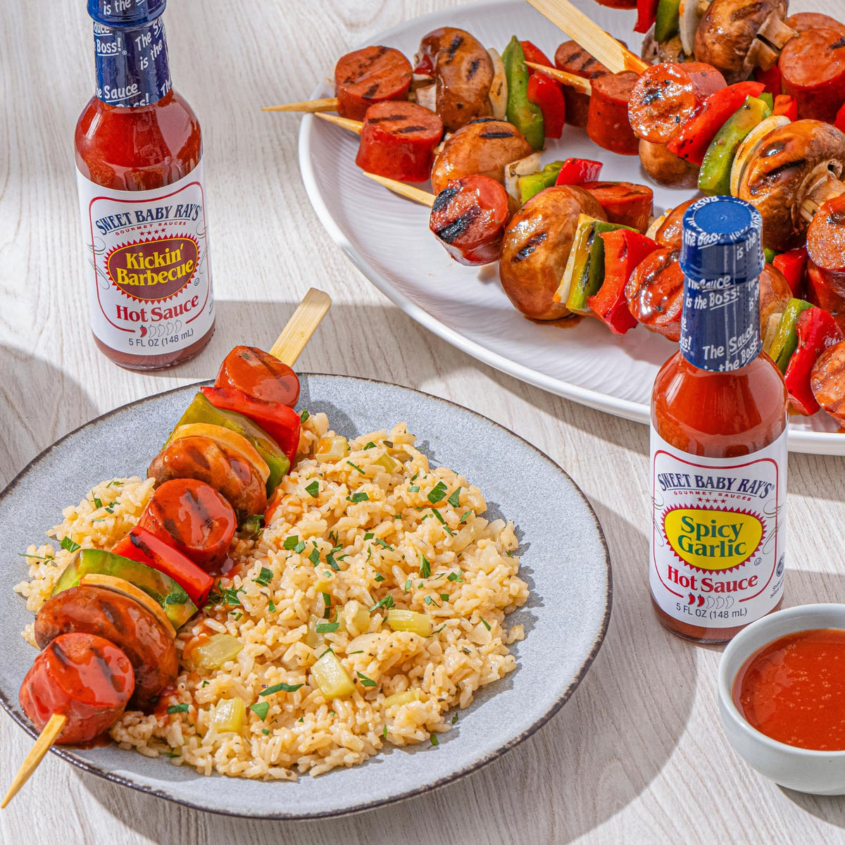 Sweet Baby Ray's Spicy Garlic hot sauce on grilled meat for garlic kick