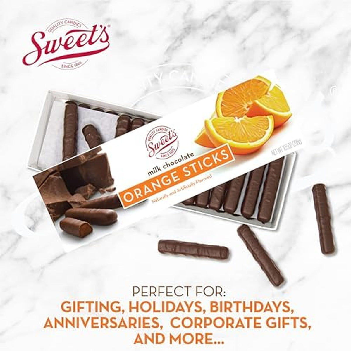 Cross-section reveals creamy orange center wrapped in milk chocolate from Sweet Candy Company.