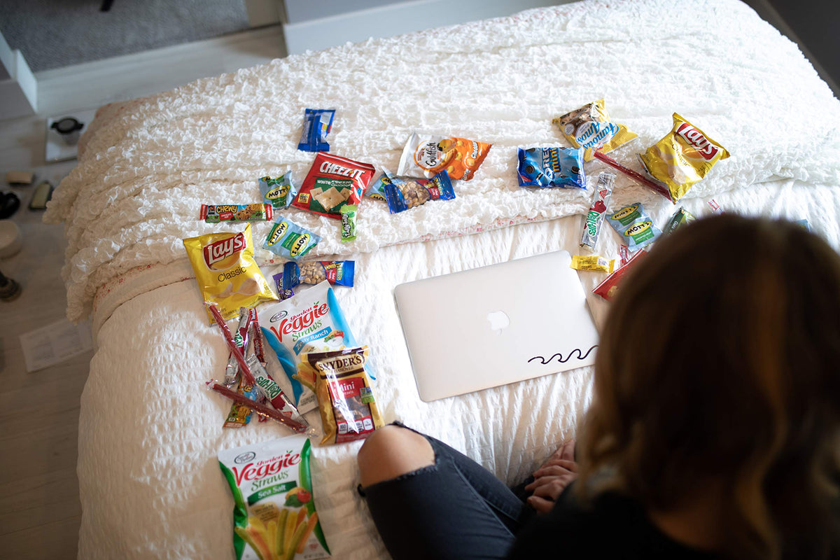 Birthday gift-ready snack basket with chips, cookies, and bars