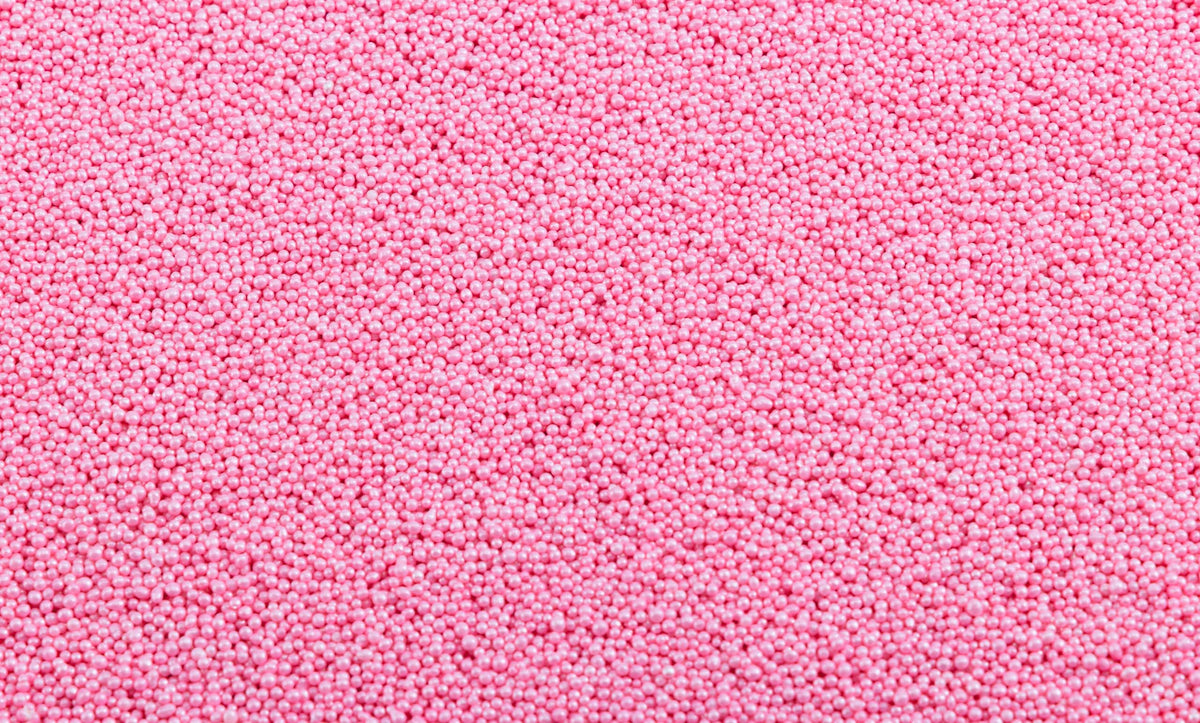 Sweet Eva’s pink nonpareils accent layer cakes with luminous touch