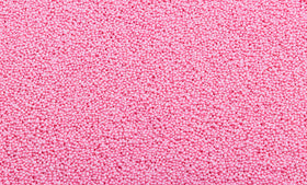 Sweet Eva’s pink nonpareils accent layer cakes with luminous touch