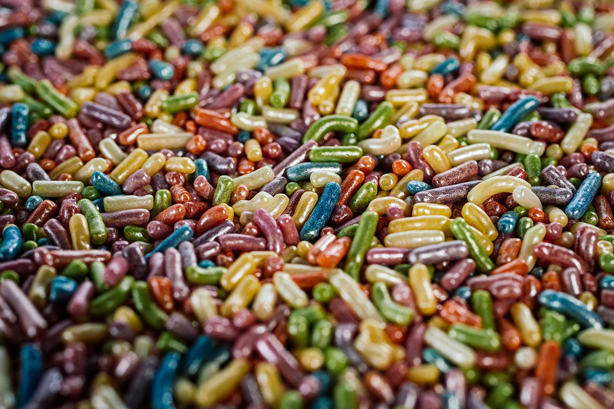 Sweet Eva’s Pearlized Rainbow Sprinkles close-up shows pearly shimmer on fondant.
