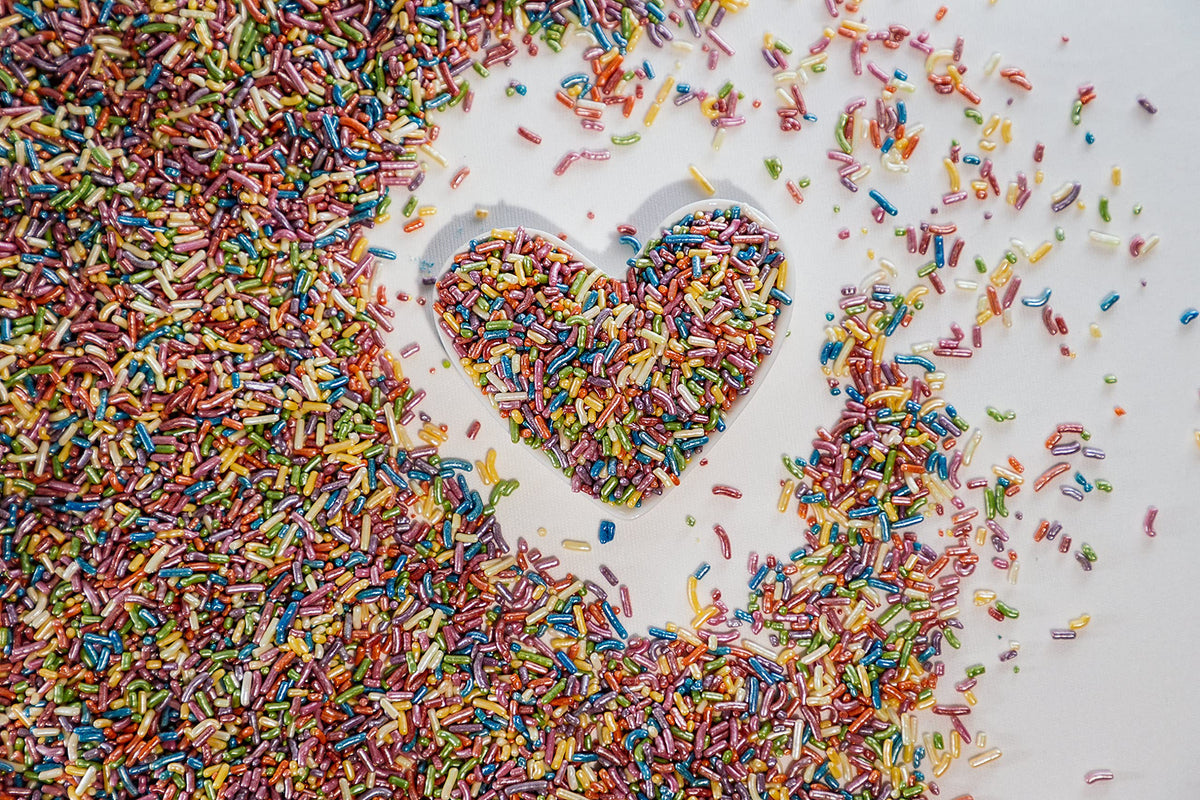 Sweet Eva’s Rainbow Sprinkles enhance ice cream with colorful crunch.