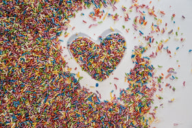 Sweet Eva’s Rainbow Sprinkles enhance ice cream with colorful crunch.