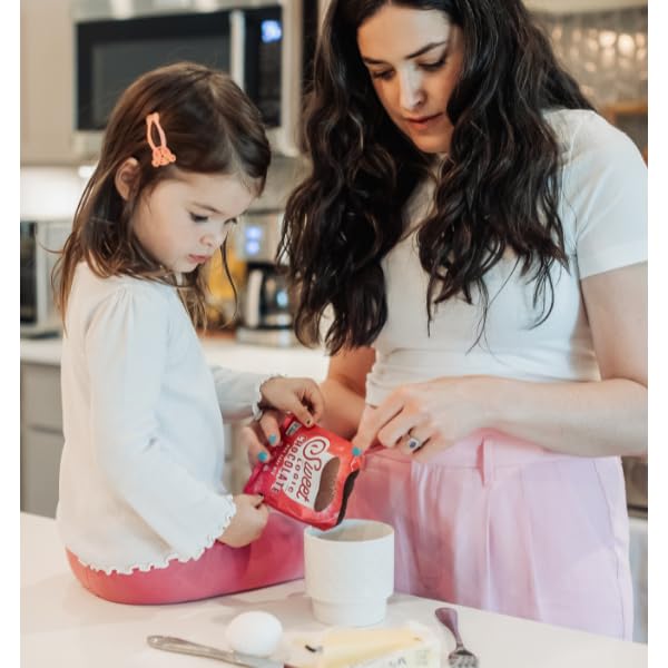 Sweet Logic mug cake mix measuring with ingredients for quick, protein-rich desserts.