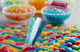 SweetGlob classic rock candy stick with light-blue crystals, kid-friendly snack.
