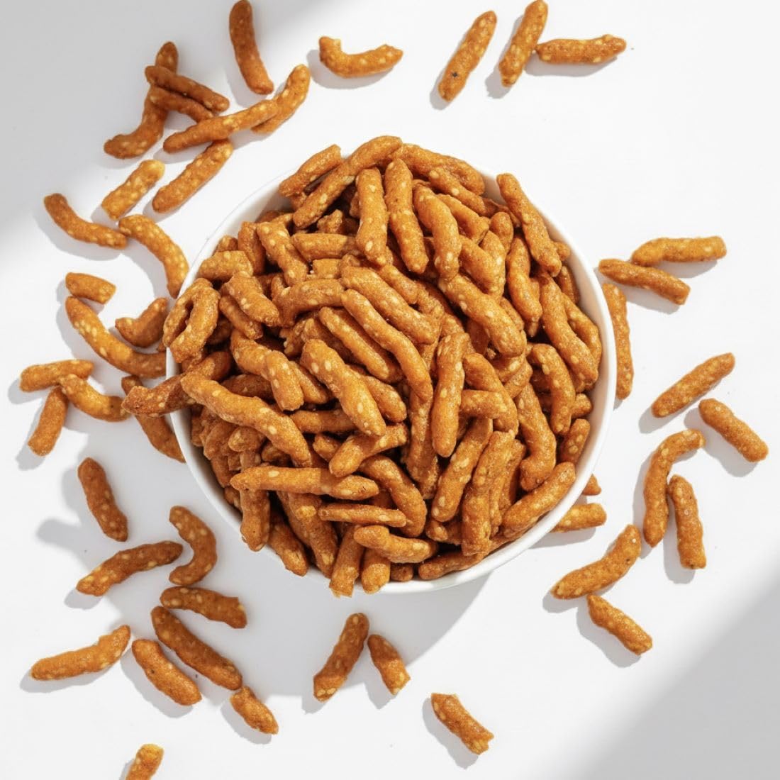 Serving view showing honey glaze and sesame seeds on sticks