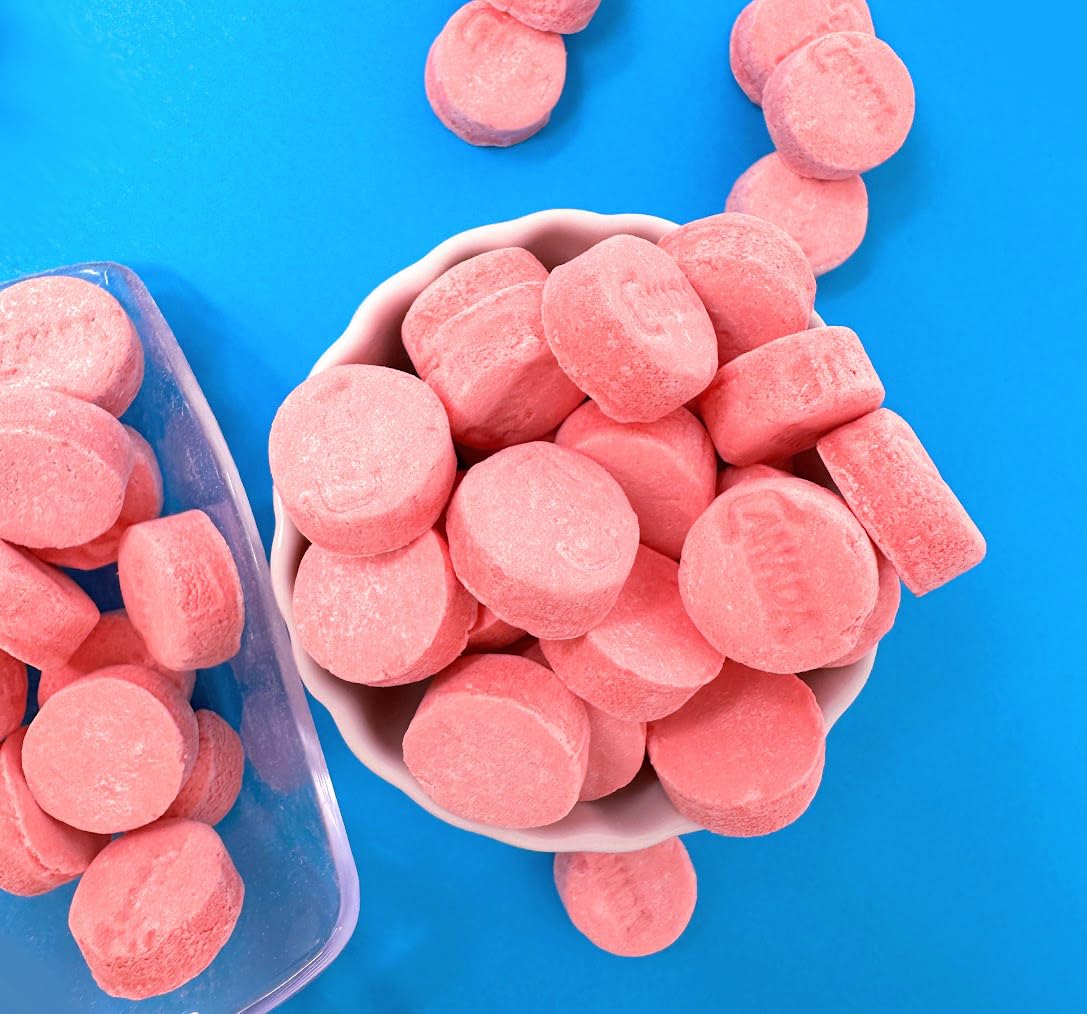 SweetGourmet Pink Wintergreen lozenges arranged in a candy dish for gatherings.