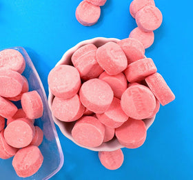 SweetGourmet Pink Wintergreen lozenges arranged in a candy dish for gatherings.