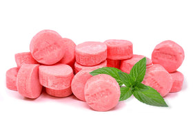 SweetGourmet Pink Wintergreen lozenges with vibrant mint color for refreshing flavor.