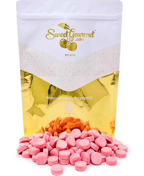 Close-up of a single SweetGourmet Pink Wintergreen Lozenge highlighting smooth texture