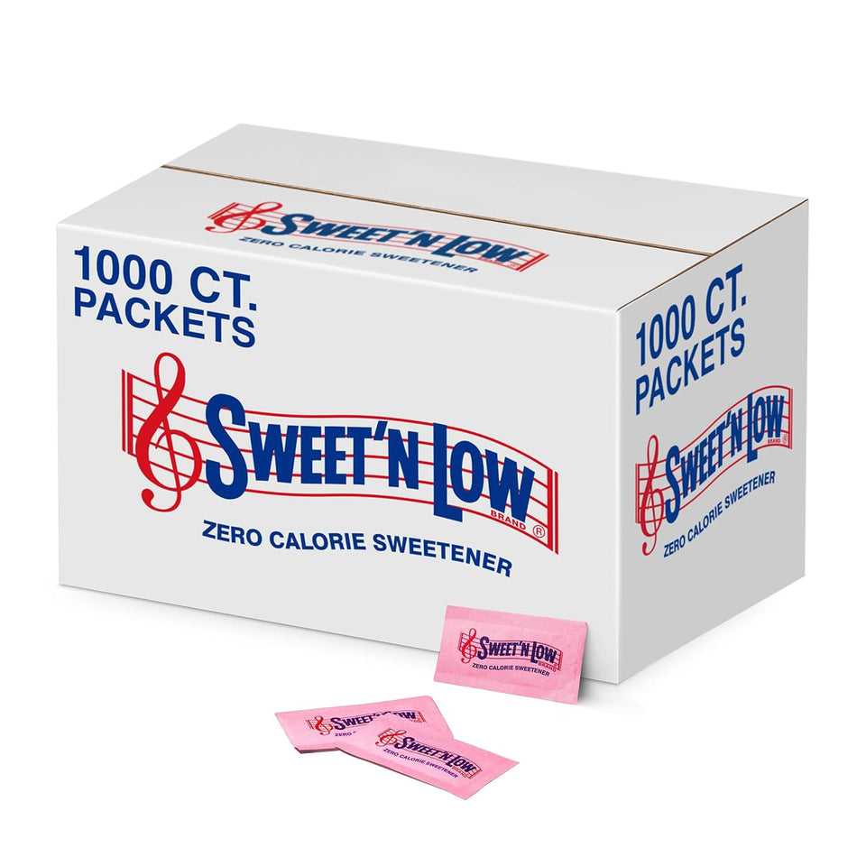 Sweet'N Low zero-calorie packets beside a coffee cup for zero calorie sweetness.