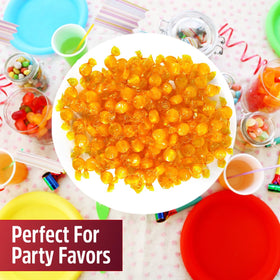 Bright party display with individually wrapped candies for guest favors.