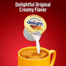 SWEETSIDE CANDY CO Original Coffee Creamer Singles pod dissolving smoothly into hot coffee.