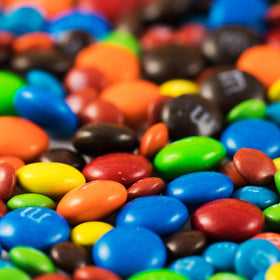 SWEETSIDE CANDY CO Colorful party snacks display with chocolate treats
