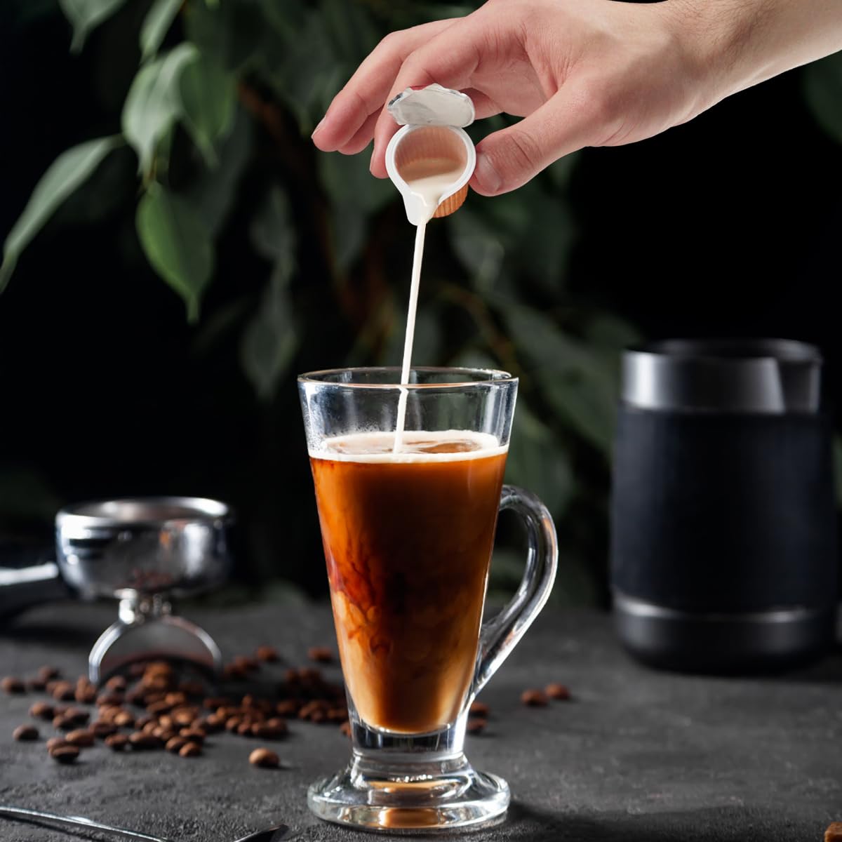 Hot coffee enhanced with SWEETSIDE Delight hazelnut creamer cup for creaminess.