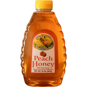 Sweetwater Creek Peach Honey bottle close-up showing peach-infused aroma for tea sweetness