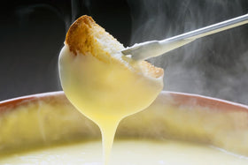 Elegant fondue night setup with Swiss Knight for gatherings.
