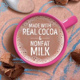 Swiss Miss pouring cocoa into mug for a creamy treat.